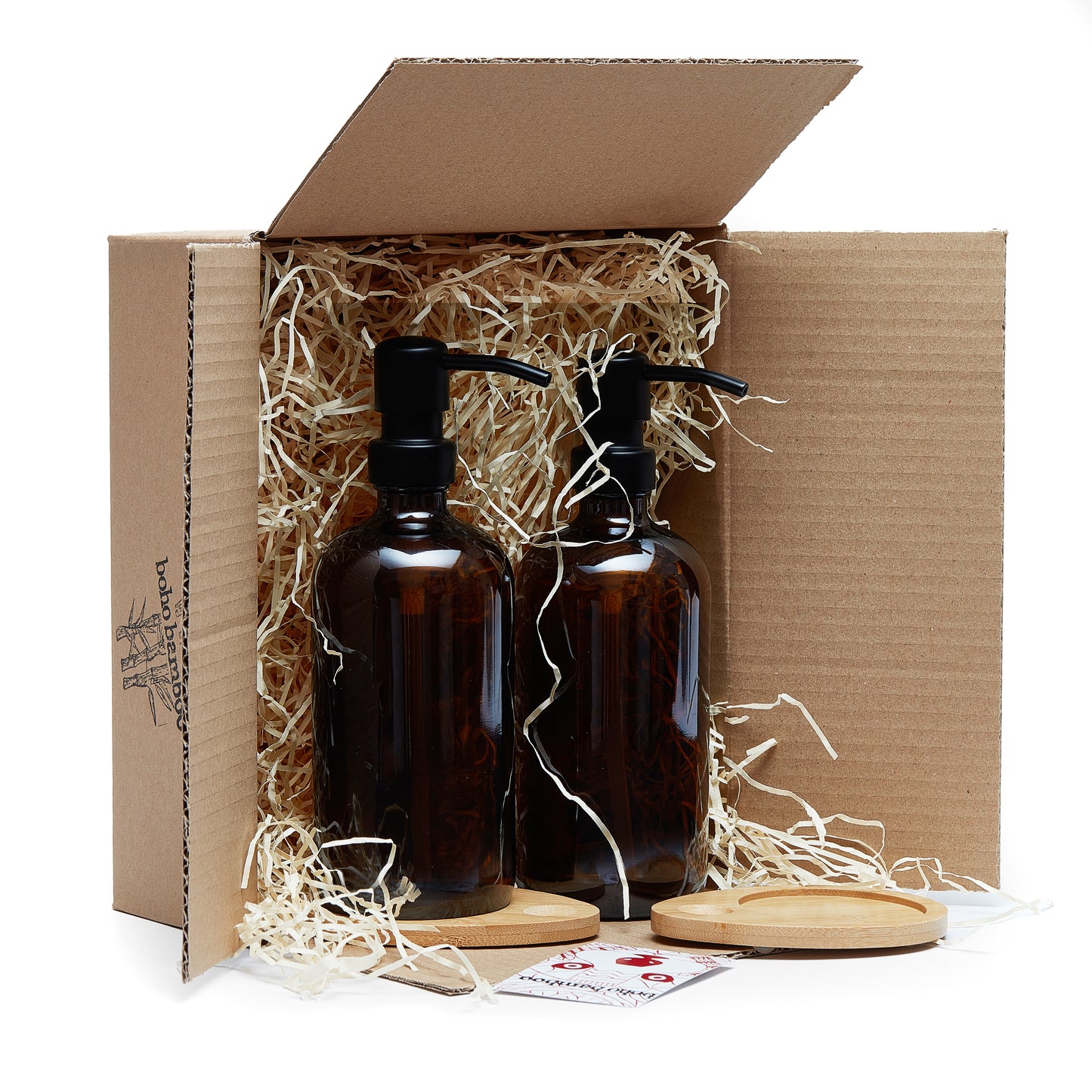 Set of two 500ml refillable amber glass pump bottles with bamboo drip trays