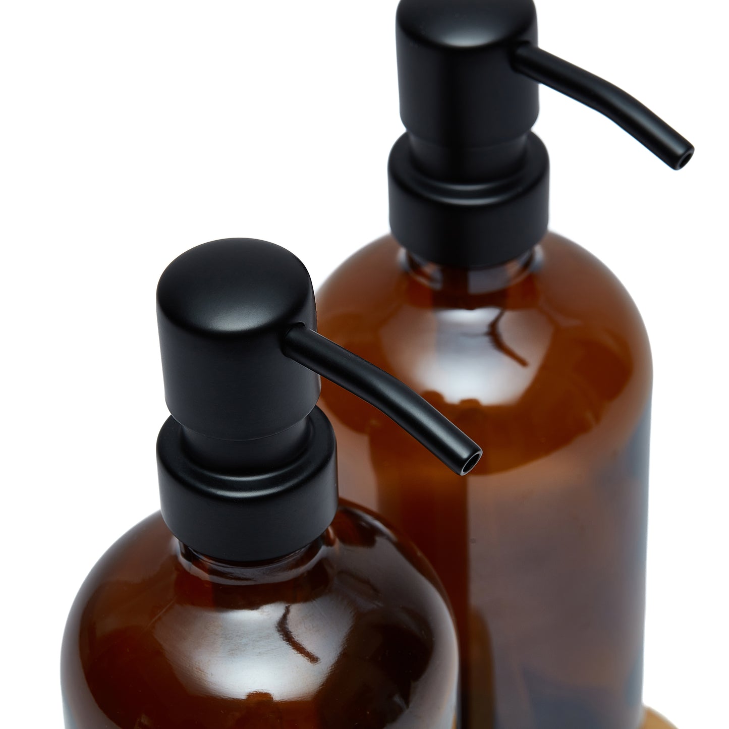 Set of two 500ml refillable amber glass pump bottles with bamboo drip trays